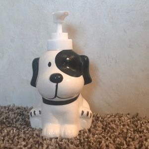 A dog looking lotion or soap dispenser